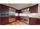 Spacious kitchen with stainless steel appliances and hardwood floors at 1891 Curtis St # 1613, Denver, CO 80202