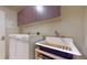 Laundry room featuring a utility sink and ample storage at 1891 Curtis St # 1613, Denver, CO 80202