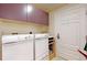Convenient laundry room with washer, dryer, and utility sink at 1891 Curtis St # 1613, Denver, CO 80202