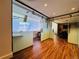 Common area office space with glass walls and wood flooring at 1891 Curtis St # 1613, Denver, CO 80202