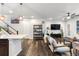 Open living room with hardwood floors and modern furniture at 2555 Mayotte Way, Castle Rock, CO 80109