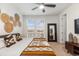 King-size bed, large windows, and modern decor make this a relaxing space at 2555 Mayotte Way, Castle Rock, CO 80109