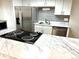 Modern kitchen with stainless steel appliances and marble countertops at 1920 S Oswego Way, Aurora, CO 80014