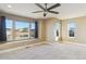 Bright bedroom with large windows, a ceiling fan, and a window seat at 10607 Rutledge St, Parker, CO 80134