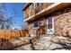 Front entrance of a brick house with steps leading up to the door at 229 Bross St # D, Longmont, CO 80501