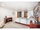 Basement bedroom with brick feature wall and ample space at 1553 Osceola St, Denver, CO 80204