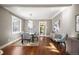 Bright dining room with hardwood floors and view into kitchen at 1553 Osceola St, Denver, CO 80204