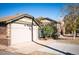 Brick detached garage with a large overhead door at 1553 Osceola St, Denver, CO 80204