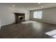 Living room with fireplace and wood-look floors at 12076 E Montana Pl, Aurora, CO 80012