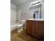 Bathroom with tub, shower, and wood vanity at 12076 E Montana Pl, Aurora, CO 80012