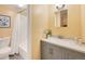 Clean bathroom with gray vanity, a tub shower combo, and updated fixtures at 2281 S Vaughn Way # 111A, Aurora, CO 80014
