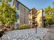 Two-story condo building exterior with landscaping at 2281 S Vaughn Way # 111A, Aurora, CO 80014