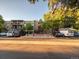 Front view of a two-story apartment building with ample parking at 2281 S Vaughn Way # 111A, Aurora, CO 80014