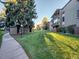 Well-maintained grassy area with a covered picnic shelter and walkway at 2281 S Vaughn Way # 111A, Aurora, CO 80014