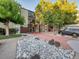 Condo building exterior with walkway and landscaping at 2281 S Vaughn Way # 111A, Aurora, CO 80014