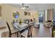 Living room with dining area, hardwood floor, and patio access at 2281 S Vaughn Way # 111A, Aurora, CO 80014