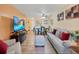 Spacious living room featuring hardwood floors, ample seating, and an open floor plan at 2281 S Vaughn Way # 111A, Aurora, CO 80014