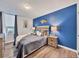 Relaxing bedroom with a blue accent wall, and comfortable bedding at 2281 S Vaughn Way # 111A, Aurora, CO 80014
