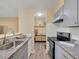 Updated kitchen, granite countertops, gray cabinets, and stainless steel appliances at 2281 S Vaughn Way # 111A, Aurora, CO 80014