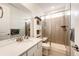 Bathroom with shower, toilet and a vanity with a large mirror at 17062 Desert Wine Ln, Parker, CO 80134