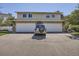 Two-unit building with attached garages and landscaping at 2466 S Vaughn Way # B, Aurora, CO 80014