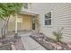 Side entryway to a townhome with a small garden at 2466 S Vaughn Way # B, Aurora, CO 80014