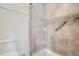 Clean bathroom with tiled shower and glass enclosure at 2466 S Vaughn Way # B, Aurora, CO 80014