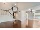Bright and airy living room with hardwood floors and staircase at 2466 S Vaughn Way # B, Aurora, CO 80014