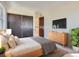Spacious bedroom featuring a neutral color palette and ample closet space at 2466 S Vaughn Way # B, Aurora, CO 80014
