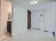 Bright entryway with tile floors, powder room, and coat closet at 2466 S Vaughn Way # B, Aurora, CO 80014