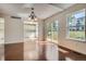 Sunlit dining area with hardwood floors and view of backyard at 2466 S Vaughn Way # B, Aurora, CO 80014