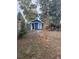 Large backyard with mature trees and plenty of space for outdoor activities at 234 S King St, Denver, CO 80219