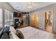 Bedroom features wood floors, ceiling fan, and a workspace at 6631 E 167Th Ave, Brighton, CO 80602