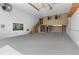 Interior of garage with stairs to a loft space at 6631 E 167Th Ave, Brighton, CO 80602