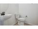 Simple bathroom with pedestal sink, toilet and modern fixtures at 4117 River Oaks St, Castle Rock, CO 80104