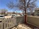 Private backyard with access gate and attached garage at 13900 Lake Song Ln # B1, Broomfield, CO 80023