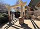 Entrance to community pool with pergola and gate at 13900 Lake Song Ln # B1, Broomfield, CO 80023