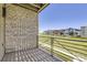 Private balcony with stone wall and view of community at 21420 E 61St Dr, Aurora, CO 80019