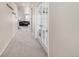 Hallway with carpet flooring and french doors leading to additional rooms at 3174 S Kirk Way, Aurora, CO 80013