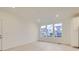 Bright dining room with light hardwood floors and large windows at 14554 W 91St Dr # A, Arvada, CO 80005