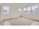 Spacious bedroom with grey carpeting and large windows at 14554 W 91St Dr # A, Arvada, CO 80005