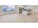 Modern kitchen with white cabinets, stainless steel appliances, and an island at 14554 W 91St Dr # A, Arvada, CO 80005