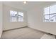 Bright bedroom with carpet flooring and large windows at 14554 W 91St Dr # A, Arvada, CO 80005