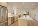 Modern kitchen island with white quartz countertops and stainless steel appliances at 4631 Zuni St, Denver, CO 80211