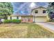 Ranch style home with attached garage and basketball hoop at 1550 S Telluride St, Aurora, CO 80017