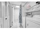 Bright laundry room with washer, dryer, and storage shelves at 1550 S Telluride St, Aurora, CO 80017