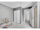 Hallway with two chairs and a door leading outside at 1550 S Telluride St, Aurora, CO 80017