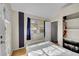 Cozy bedroom with a twin bed and access to a private patio at 1550 S Telluride St, Aurora, CO 80017