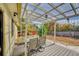 Covered patio with a glass-top table and chairs, perfect for outdoor dining at 1550 S Telluride St, Aurora, CO 80017