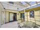 Covered patio adjacent to the house, offering a shaded seating area at 1550 S Telluride St, Aurora, CO 80017